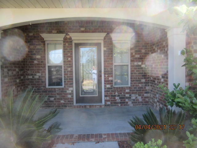 4434 Mirada Way Crestview, FL 32539 - Photo 1 of 21 a view of a brick house with potted plants