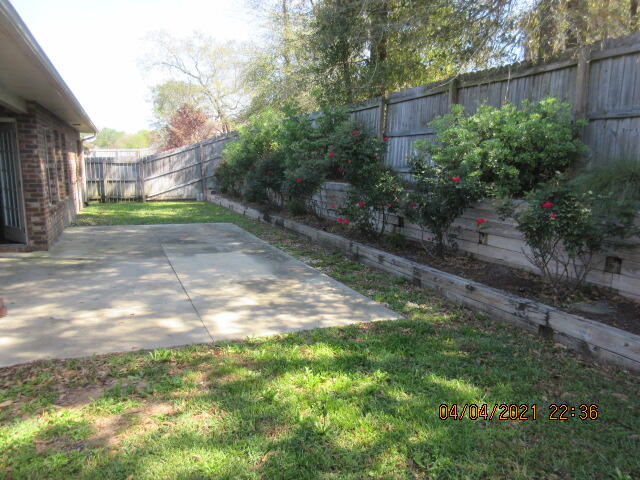 4434 Mirada Way Crestview, FL 32539 - Photo 20 of 21 a view of a yard with plants and a trees
