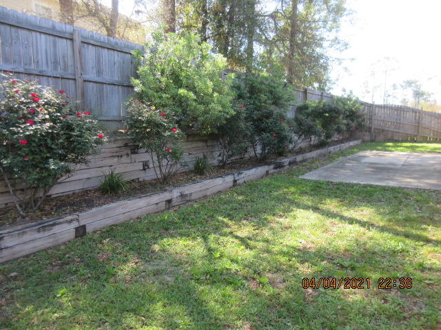 4434 Mirada Way Crestview, FL 32539 - Photo 21 of 21 a backyard of a house with lots of green space