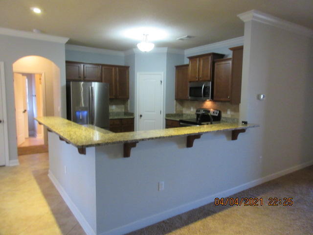 4434 Mirada Way Crestview, FL 32539 - Photo 6 of 21 a kitchen with counter top space cabinets and stainless steel appliances