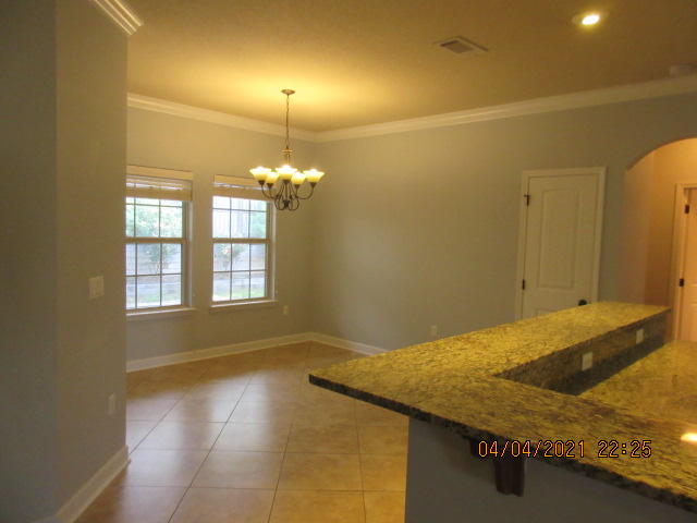 4434 Mirada Way Crestview, FL 32539 - Photo 9 of 21 a bathroom with a granite countertop sink and a mirror