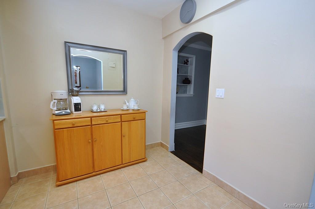 253 Garth Road, Unit 1T Scarsdale, NY 10583 - Photo 14 of 45 a bathroom with a sink and a mirror