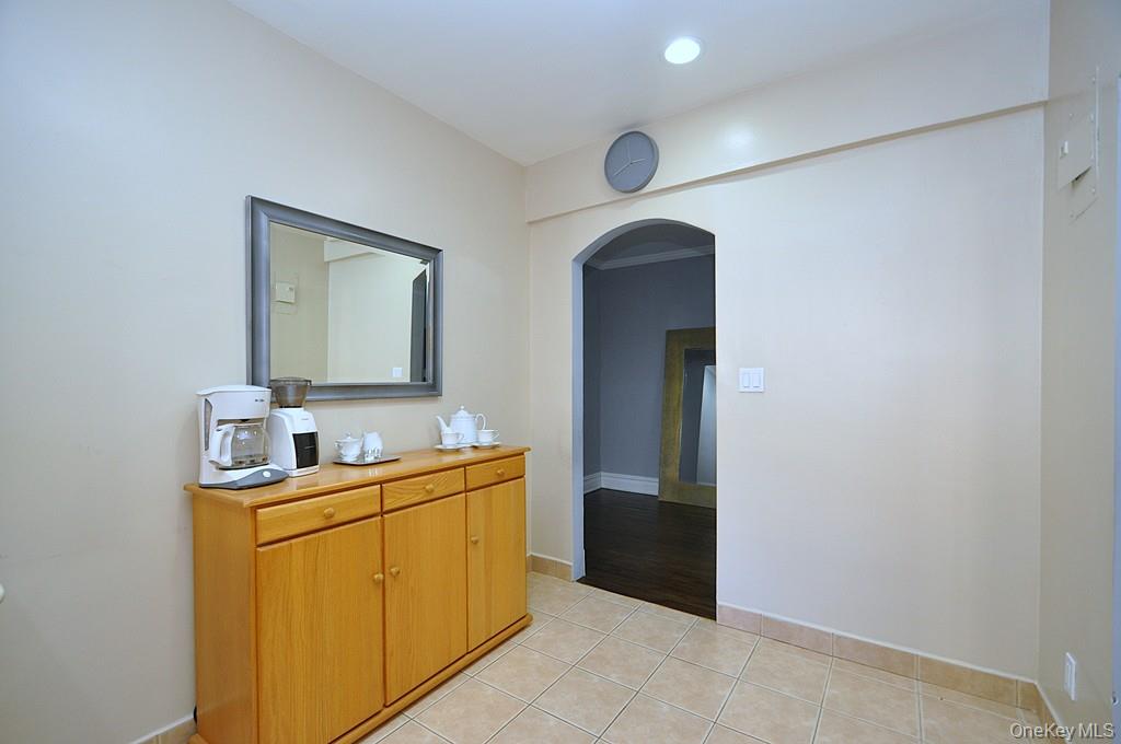 253 Garth Road, Unit 1T Scarsdale, NY 10583 - Photo 15 of 45 a room with mirror and a sink