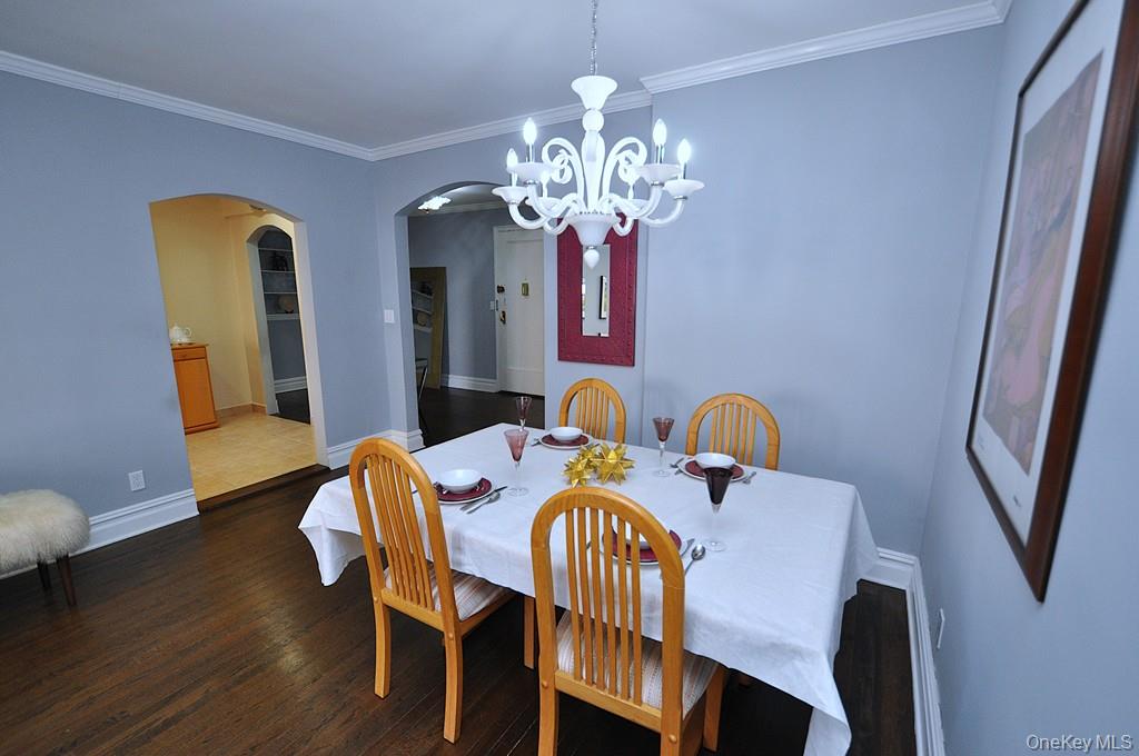 253 Garth Road, Unit 1T Scarsdale, NY 10583 - Photo 17 of 45 a view of a dining room with furniture and wooden floor
