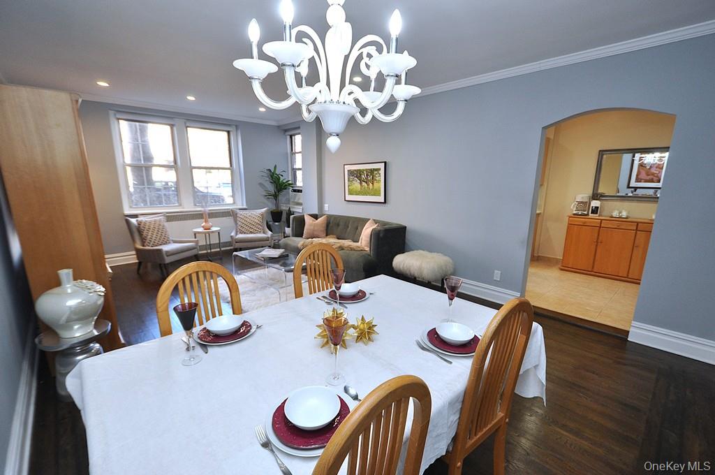 253 Garth Road, Unit 1T Scarsdale, NY 10583 - Photo 19 of 45 a view of a dining room with furniture window and wooden floor