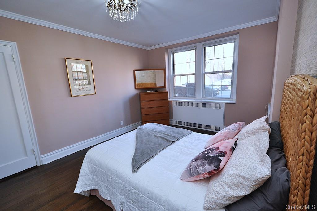 253 Garth Road, Unit 1T Scarsdale, NY 10583 - Photo 22 of 45 a bedroom with a bed and a window