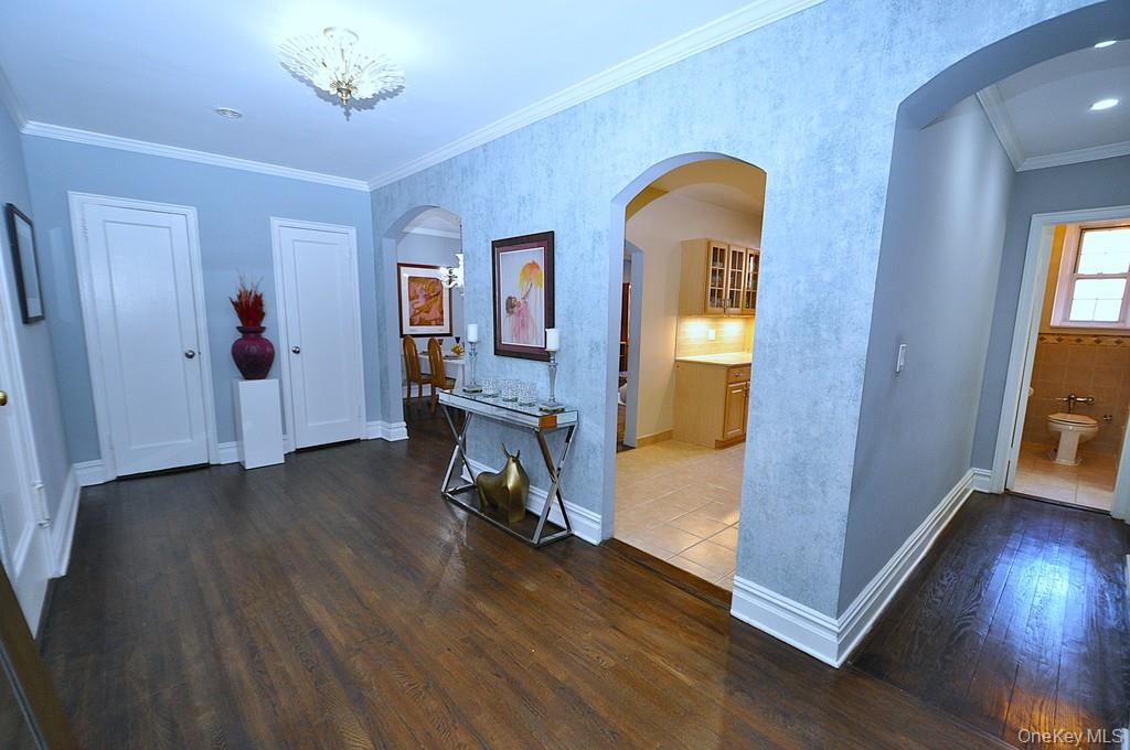 253 Garth Road, Unit 1T Scarsdale, NY 10583 - Photo 27 of 45 a view of a livingroom with wooden floor and furniture