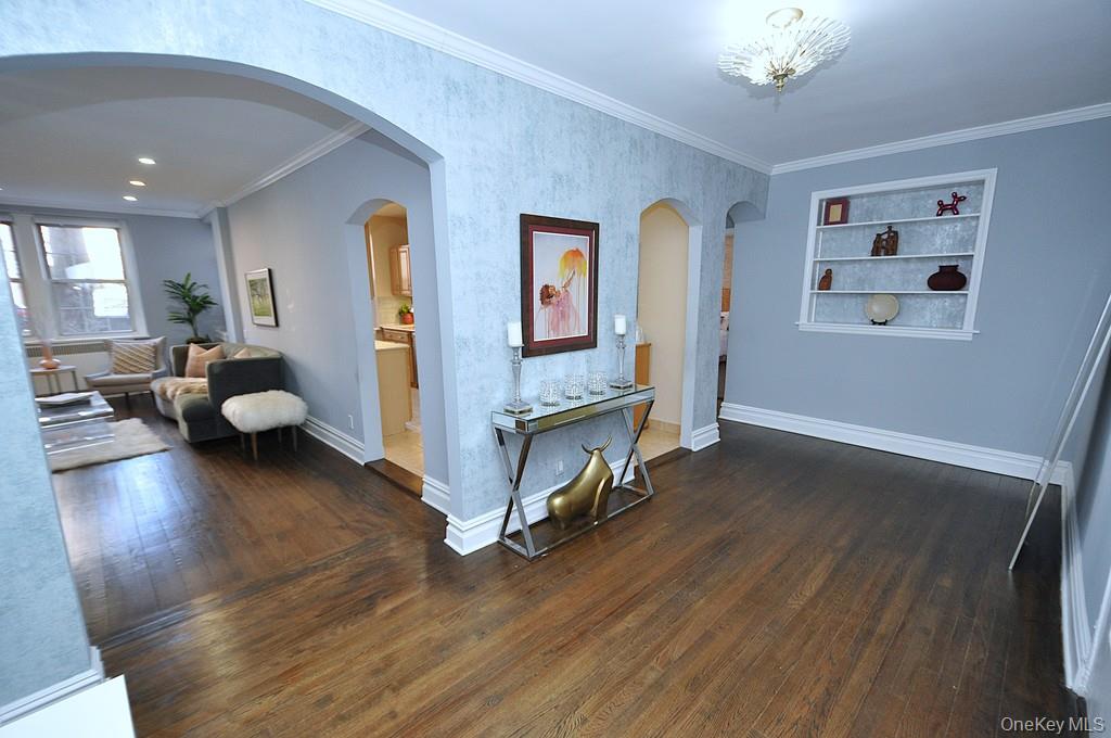 253 Garth Road, Unit 1T Scarsdale, NY 10583 - Photo 28 of 45 a living room with furniture and wooden floor