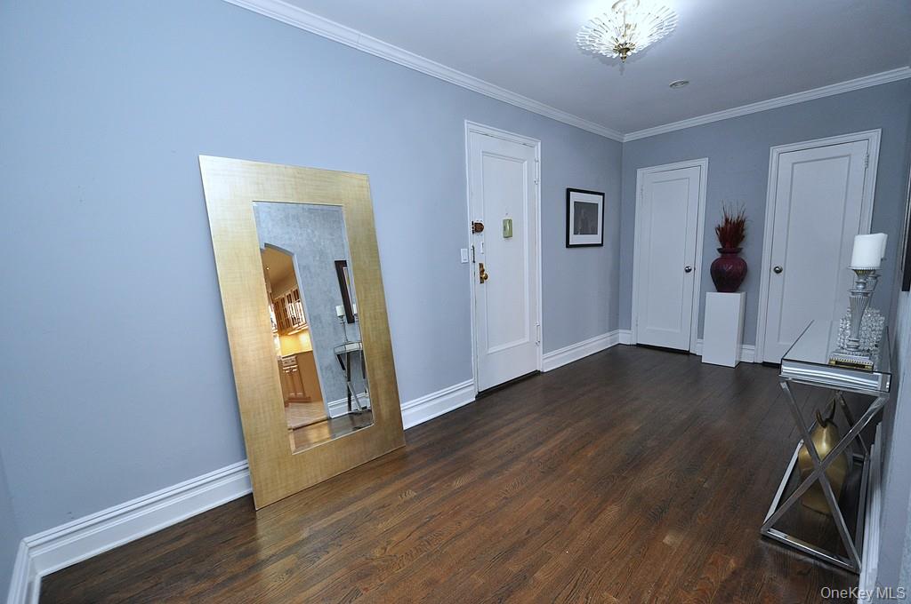 253 Garth Road, Unit 1T Scarsdale, NY 10583 - Photo 29 of 45 a view of empty room with wooden floor