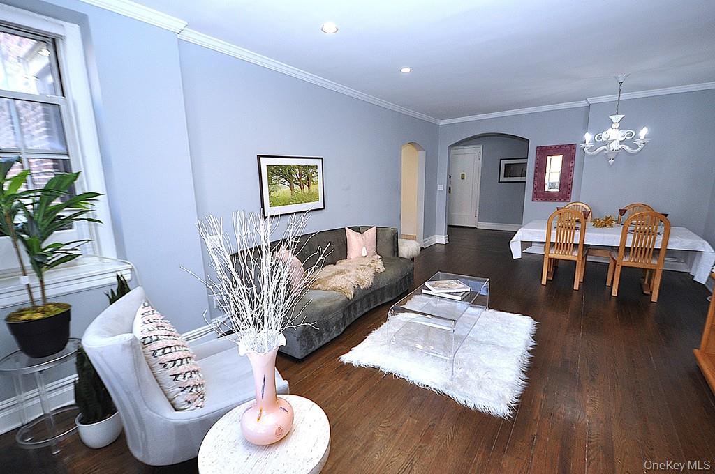 253 Garth Road, Unit 1T Scarsdale, NY 10583 - Photo 7 of 45 a living room with furniture and a wooden floor