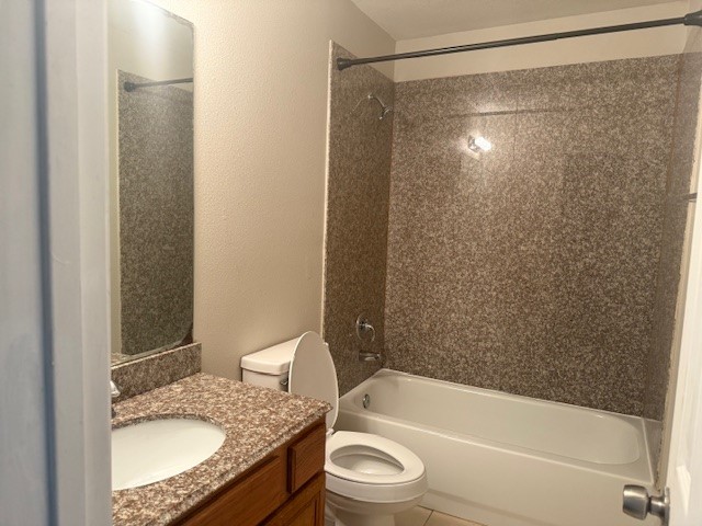 5419 Quail Cove Lane Houston, TX 77053 - Photo 11 of 13 a bathroom with a granite countertop sink toilet and shower