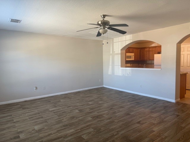 5419 Quail Cove Lane Houston, TX 77053 - Photo 2 of 13 a view of an empty room with a window and wooden floor