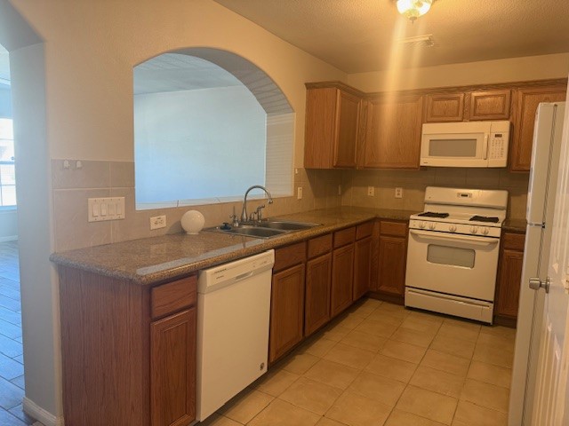 5419 Quail Cove Lane Houston, TX 77053 - Photo 5 of 13 a kitchen with a sink stove and cabinets