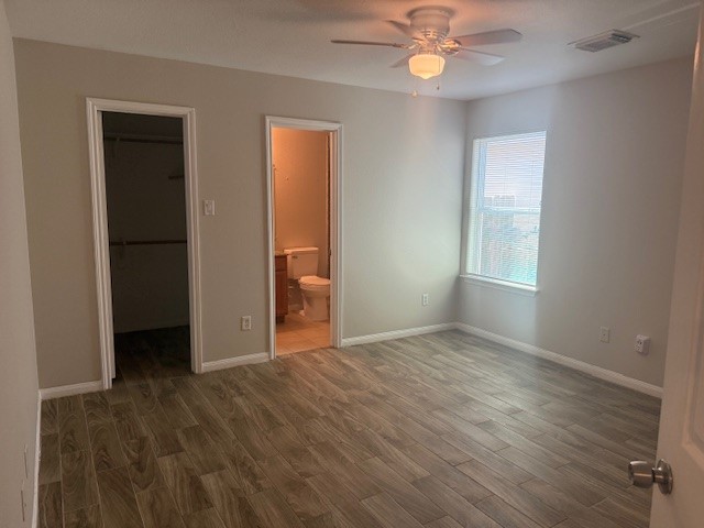 5419 Quail Cove Lane Houston, TX 77053 - Photo 6 of 13 wooden floor in an empty room with a window