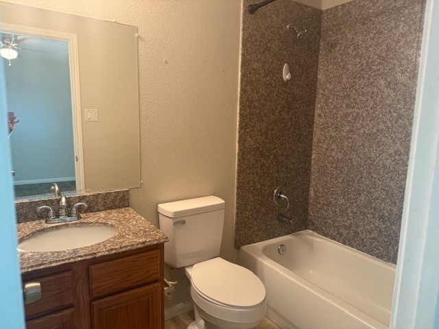 5419 Quail Cove Lane Houston, TX 77053 - Photo 7 of 13 a bathroom with a granite countertop sink toilet and shower