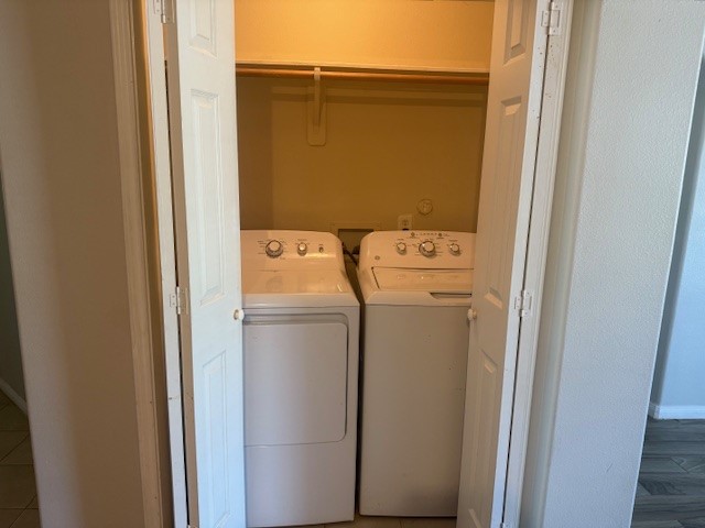 5419 Quail Cove Lane Houston, TX 77053 - Photo 8 of 13 a utility room with dryer and washer