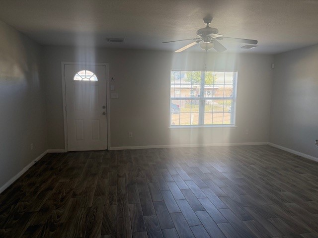 5419 Quail Cove Lane Houston, TX 77053 - Photo 9 of 13 an empty room with wooden floor and windows