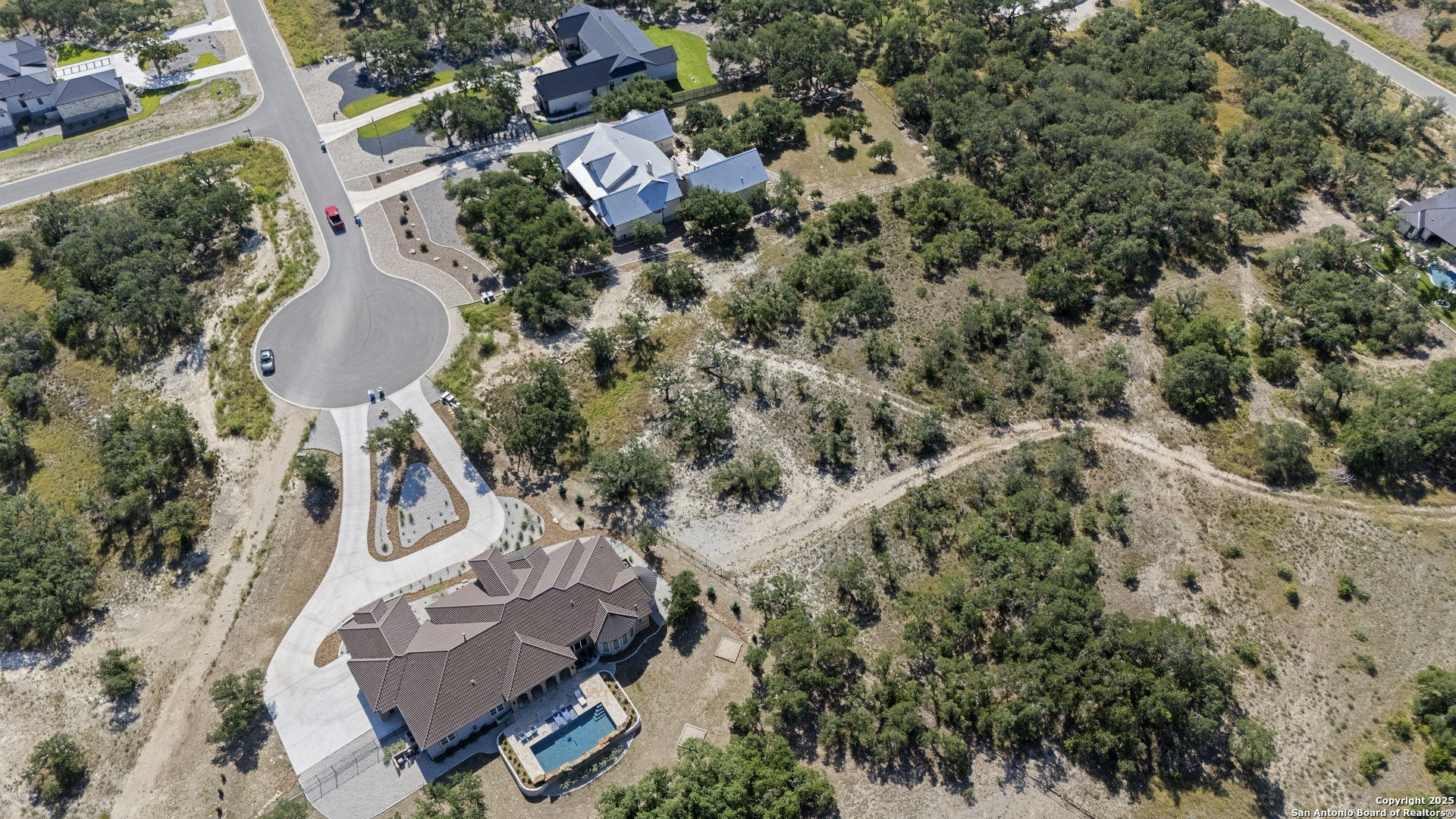 749 Johanna Rdg Road Bulverde, TX 78163 - Photo 12 of 26 an aerial view of a house with a yard and lake view