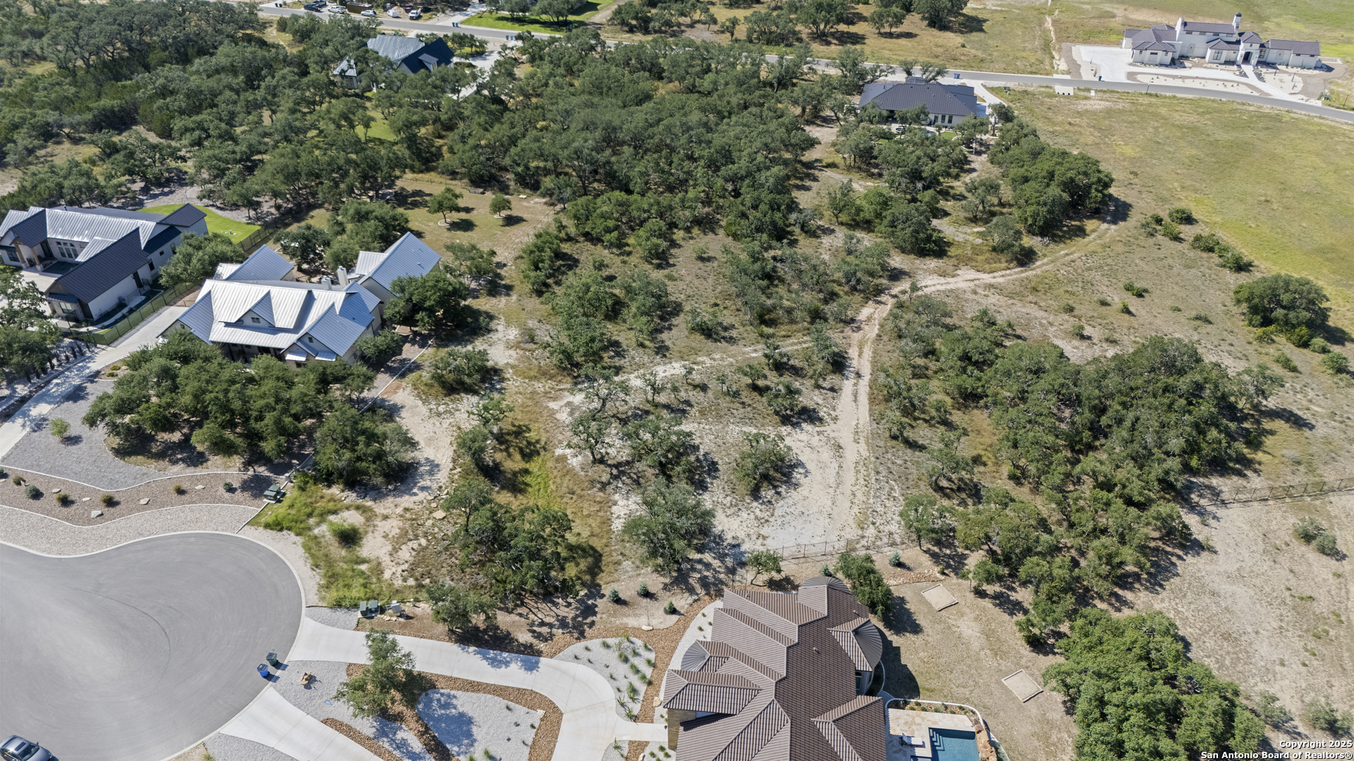 749 Johanna Rdg Road Bulverde, TX 78163 - Photo 10 of 26 an aerial view of residential house with outdoor space and trees all around