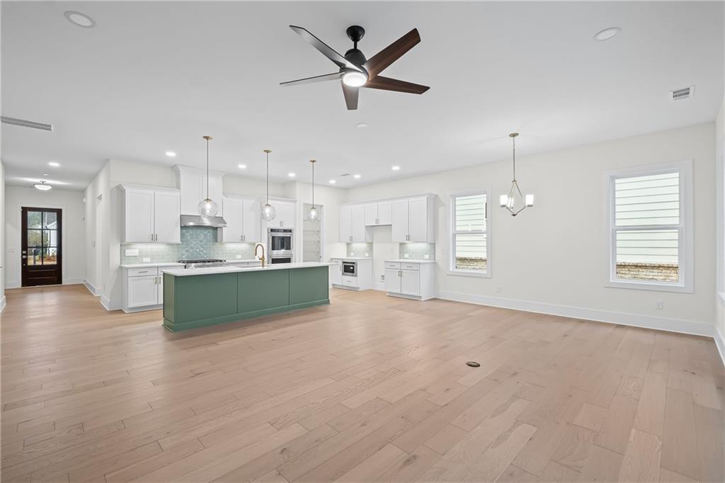 178 Mooney Road Woodstock, GA 30188 - Photo 11 of 42 a large kitchen with kitchen island lots of counter top space and appliances