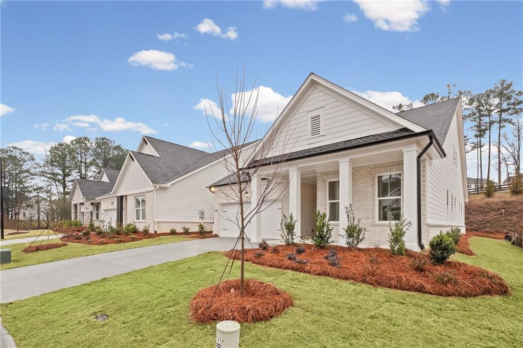178 Mooney Road Woodstock, GA 30188 - Photo 2 of 42 a view of a house with backyard and sitting area