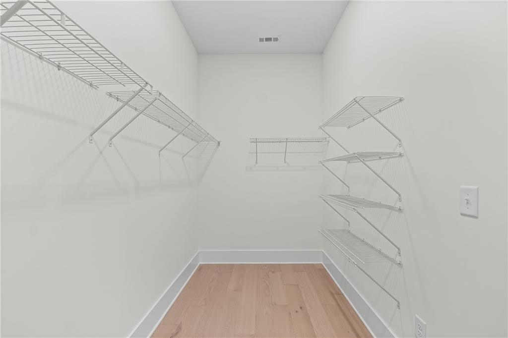 178 Mooney Road Woodstock, GA 30188 - Photo 21 of 42 a view of a room with racks on the wall