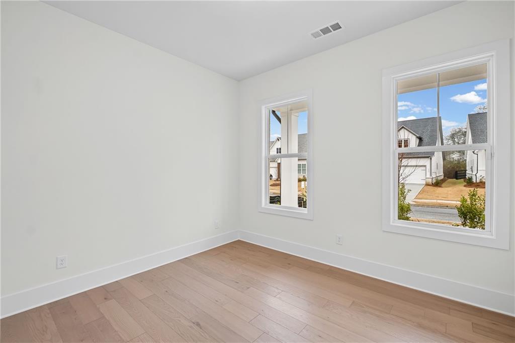 178 Mooney Road Woodstock, GA 30188 - Photo 23 of 42 an empty room with windows and closet
