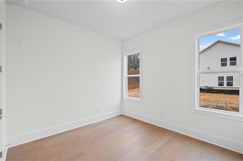 178 Mooney Road Woodstock, GA 30188 - Photo 24 of 42 an empty room with a window