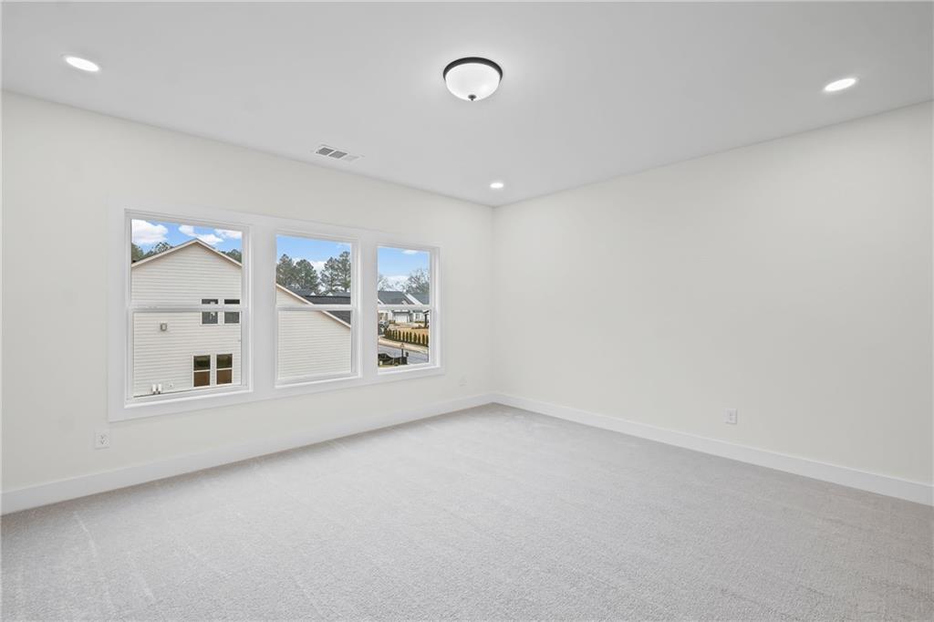 178 Mooney Road Woodstock, GA 30188 - Photo 27 of 42 an empty room with a empty space and window