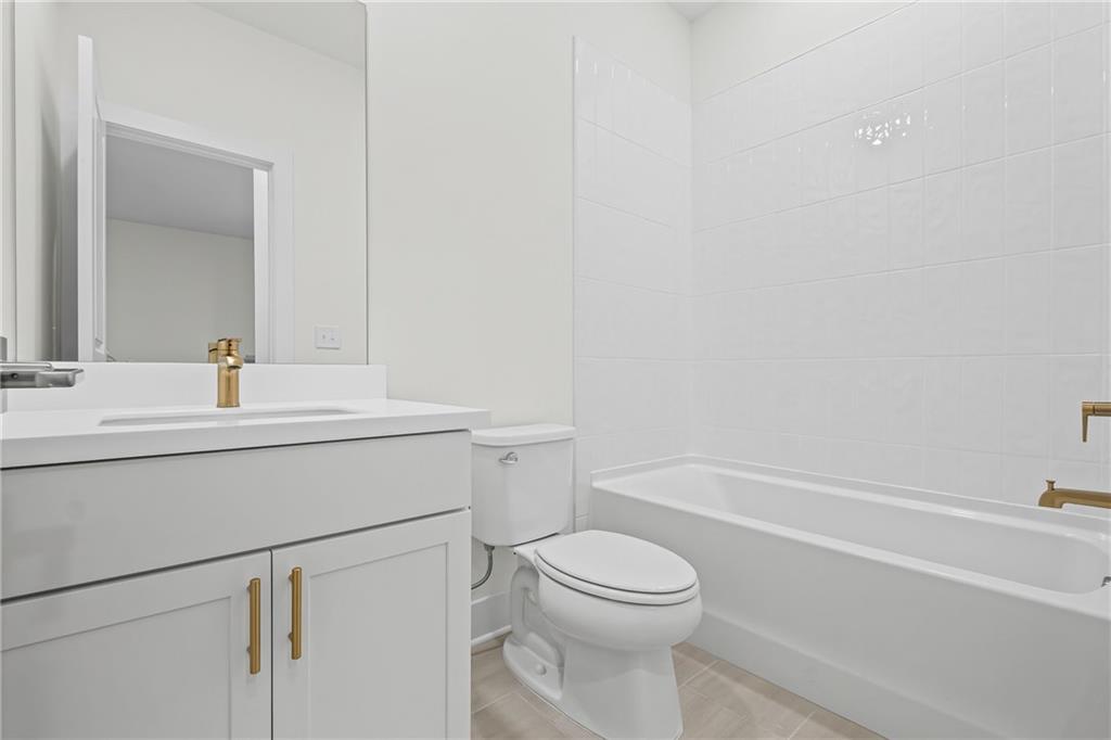 178 Mooney Road Woodstock, GA 30188 - Photo 29 of 42 a bathroom with a sink a toilet and bathtub