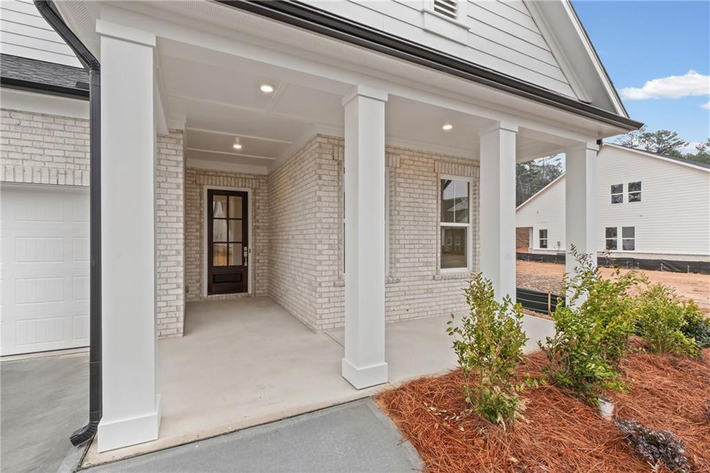 178 Mooney Road Woodstock, GA 30188 - Photo 3 of 42 front view of a house with a yard