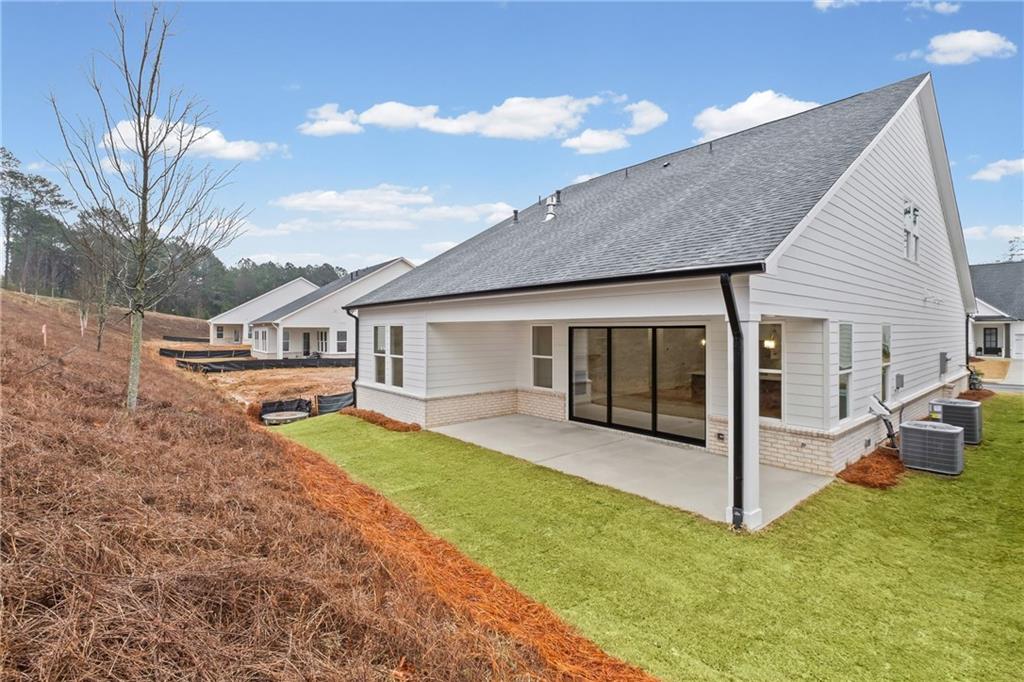 178 Mooney Road Woodstock, GA 30188 - Photo 31 of 42 a view of a house with backyard