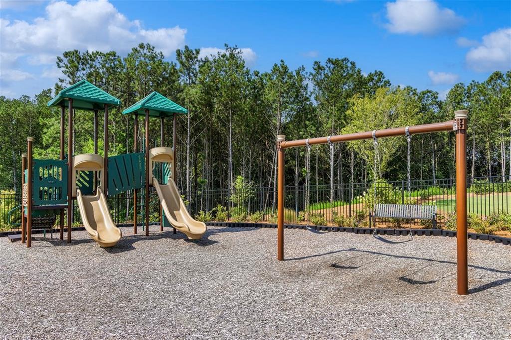178 Mooney Road Woodstock, GA 30188 - Photo 39 of 42 a view of a park with a slide