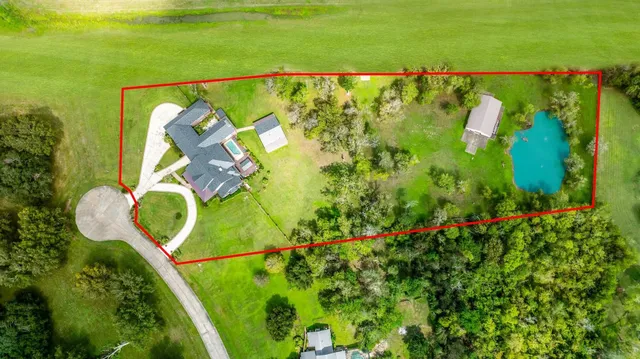 a view of a lake with a house in the background