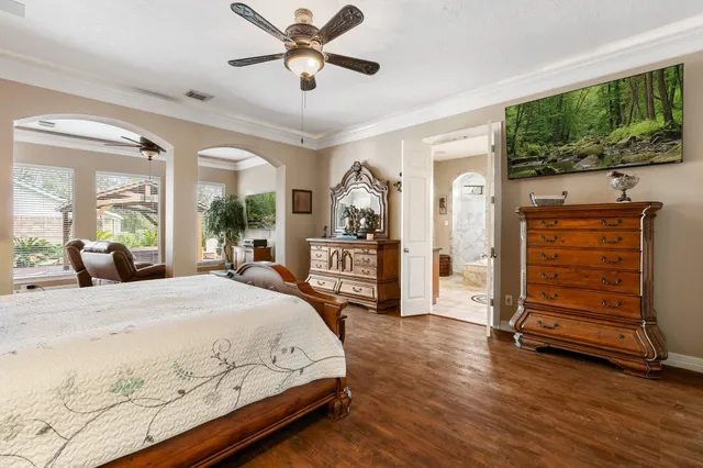 a living room with furniture cabinets and window
