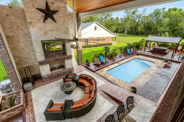 a view of a patio with couches and potted plants