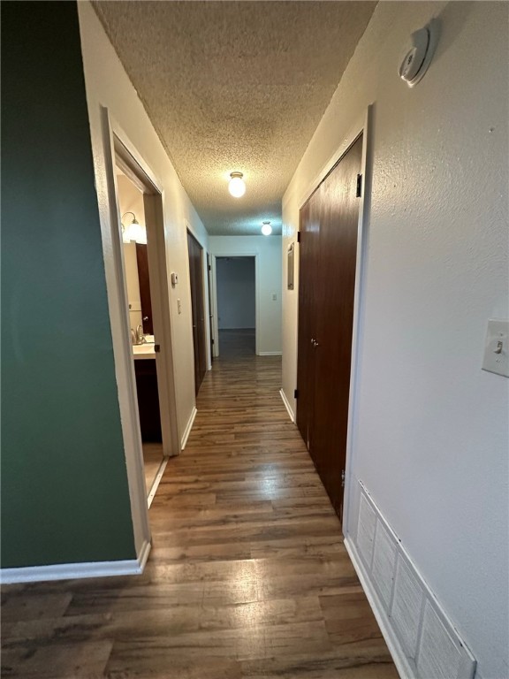 4229 Interstate Highway, Unit 4 Corpus Christi, TX 78410 - Photo 12 of 12 a view of hallway with wooden floor