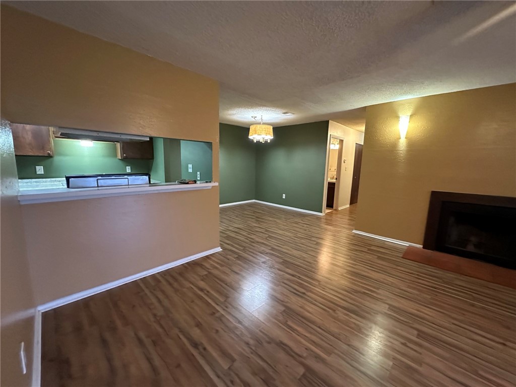 4229 Interstate Highway, Unit 4 Corpus Christi, TX 78410 - Photo 6 of 12 a view of a livingroom with wooden floor and kitchen space