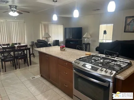 a kitchen with a stove a sink and a refrigerator