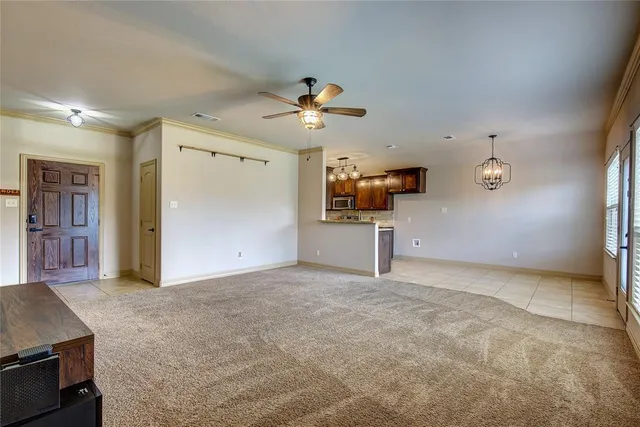 a view of a kitchen with a sink hardwood floor and a kitchen island