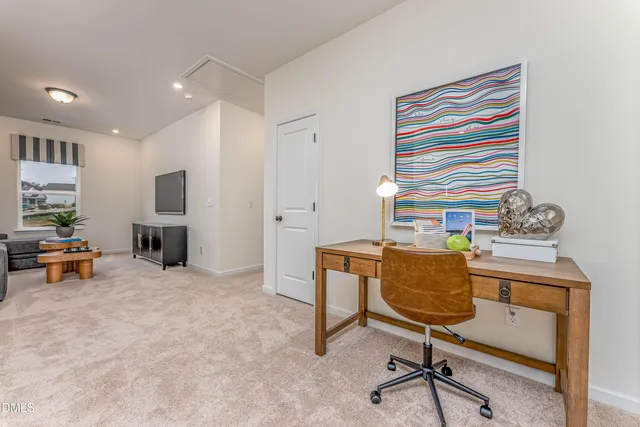 a livingroom with furniture and a fireplace