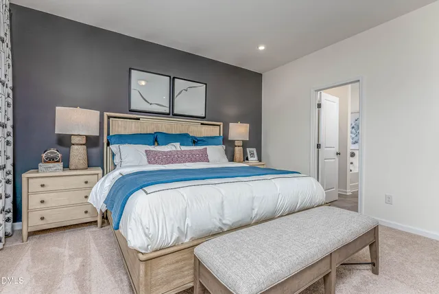 a bedroom with a bed and a dresser