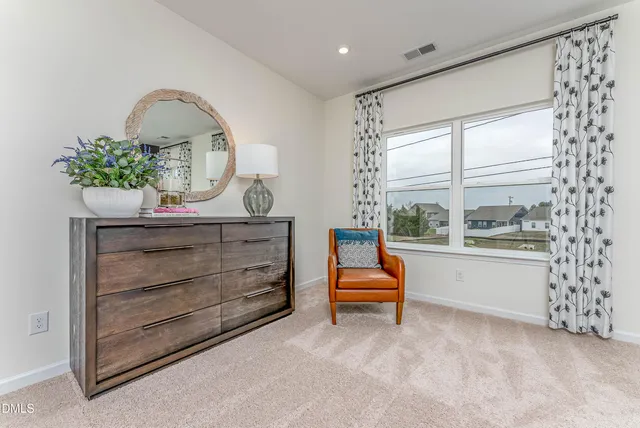 a view of room with furniture and a window