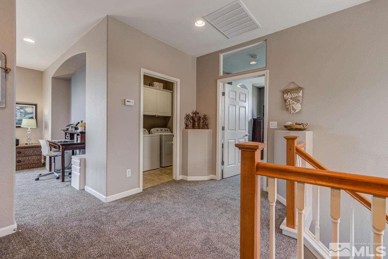 9275 Hummer Drive Reno, NV 89521 - Photo 20 of 33 a view of a hallway with workspace to rooms