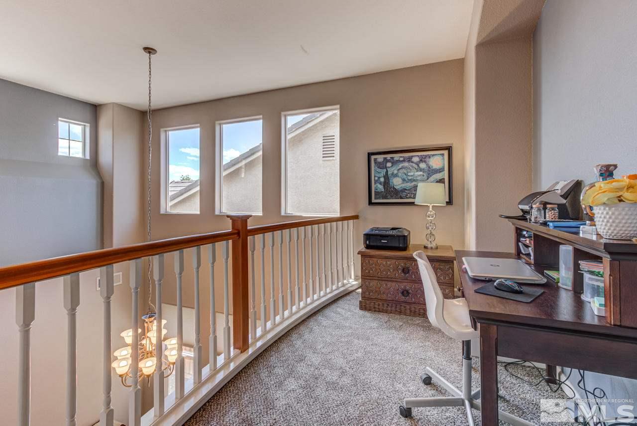 9275 Hummer Drive Reno, NV 89521 - Photo 21 of 33 a view of a workspace with furniture and a window