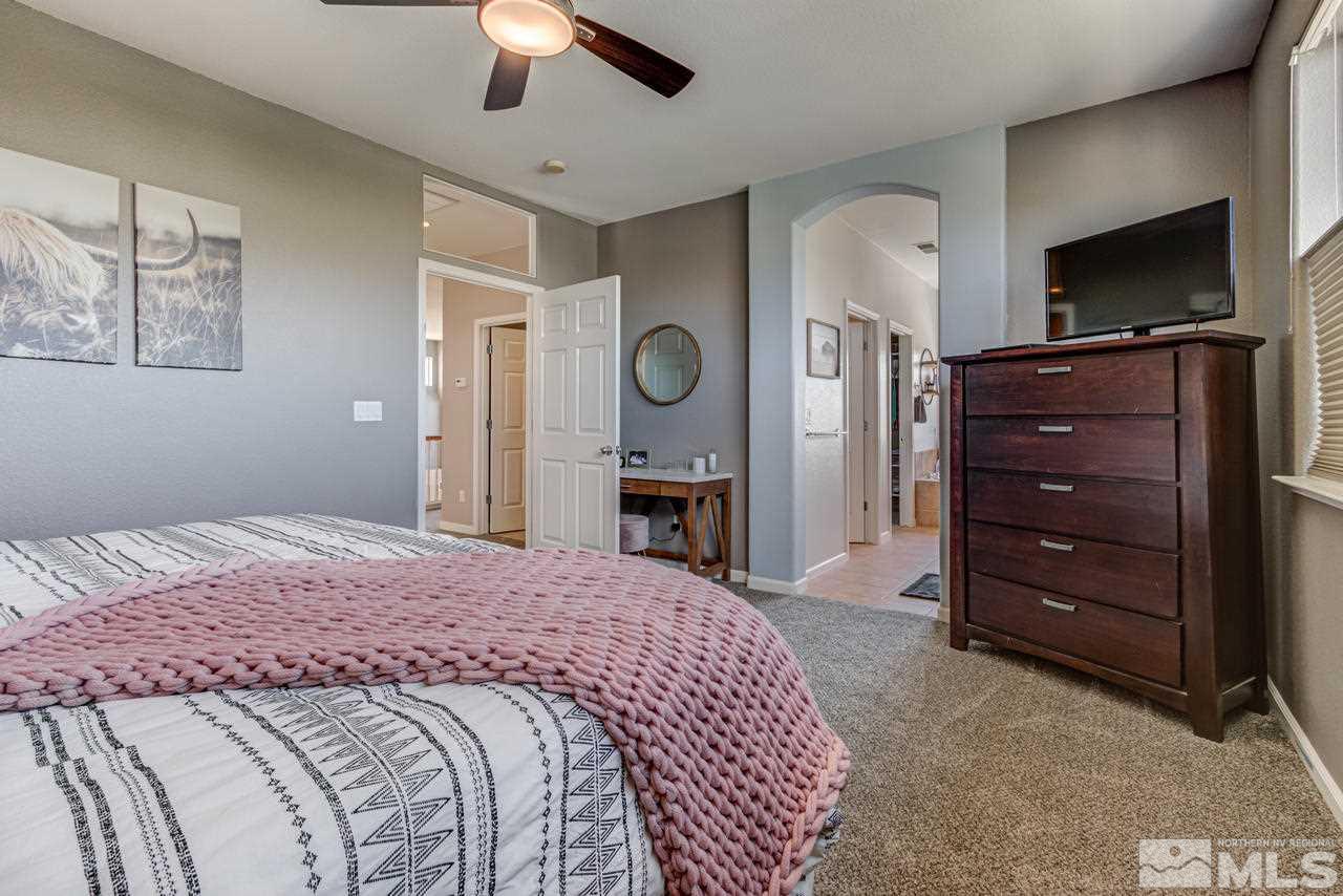 9275 Hummer Drive Reno, NV 89521 - Photo 23 of 33 a bedroom with a bed and a television