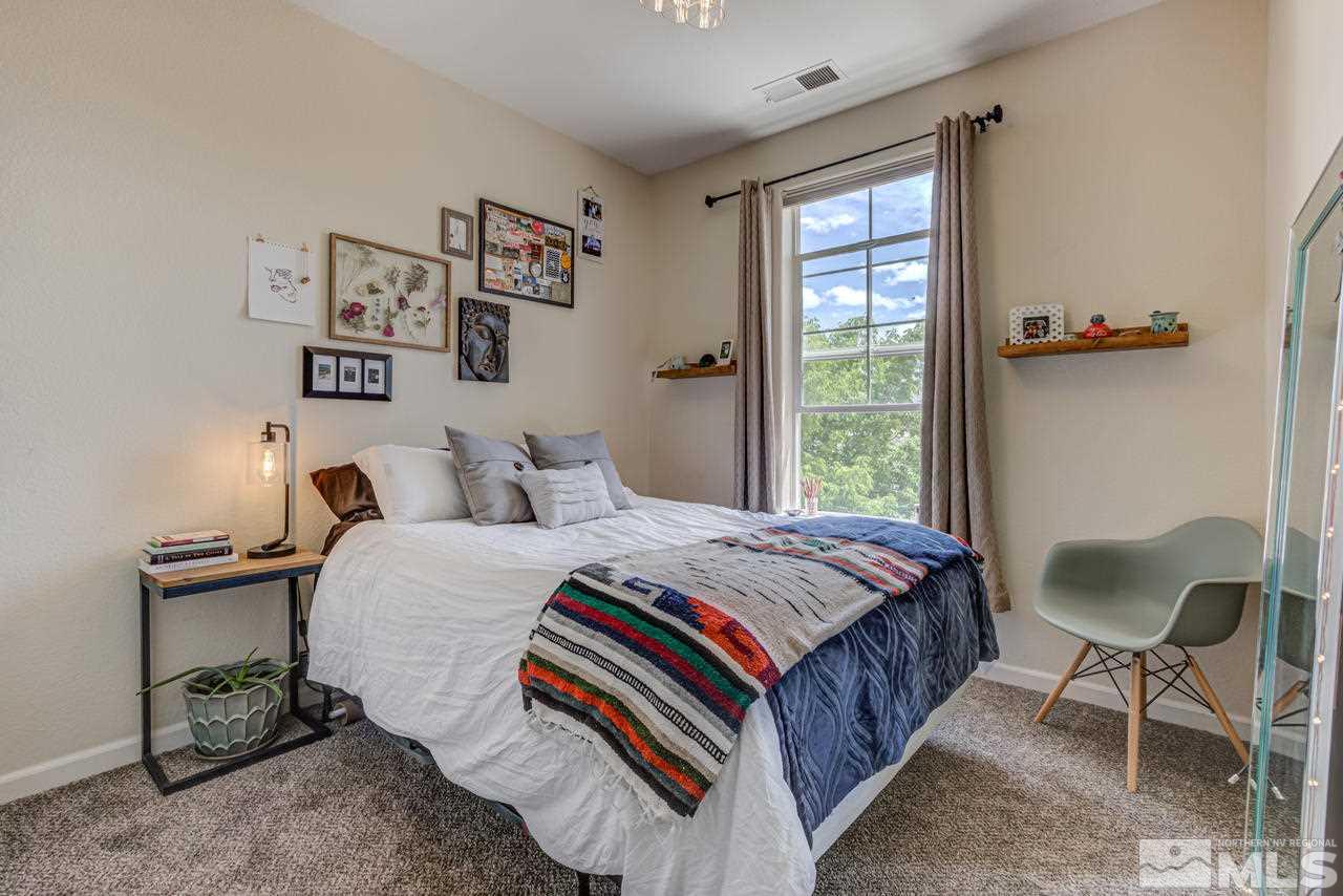 9275 Hummer Drive Reno, NV 89521 - Photo 27 of 33 a bedroom with a bed and a window
