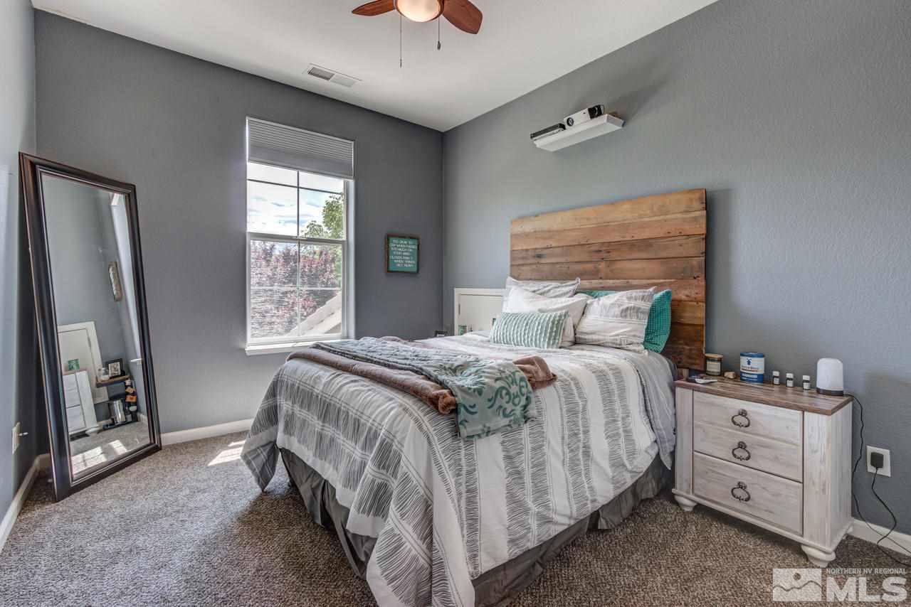 9275 Hummer Drive Reno, NV 89521 - Photo 28 of 33 a bedroom with a bed and a window