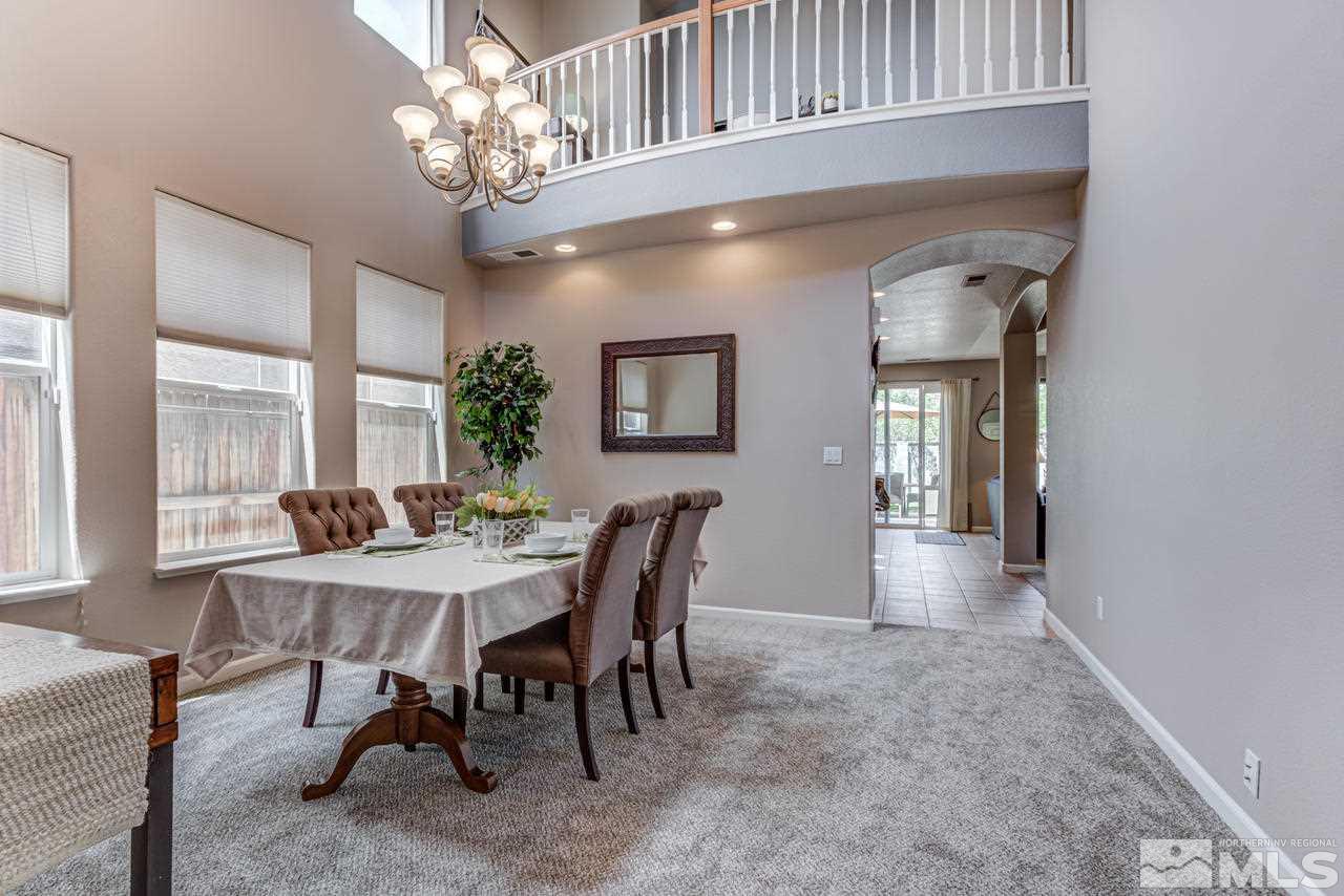 9275 Hummer Drive Reno, NV 89521 - Photo 3 of 33 a view of a dining room with furniture and a chandelier