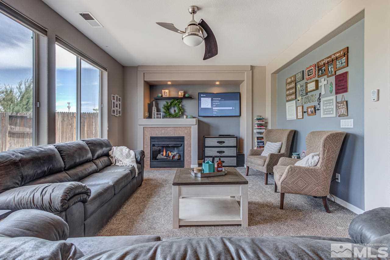 9275 Hummer Drive Reno, NV 89521 - Photo 7 of 33 a living room with furniture and a fireplace